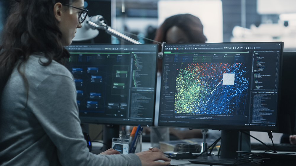 Distribution utility control room operator monitoring grid data