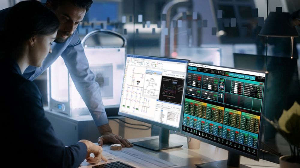 Engineers reviewing microgrid dashboards on multiple monitors
